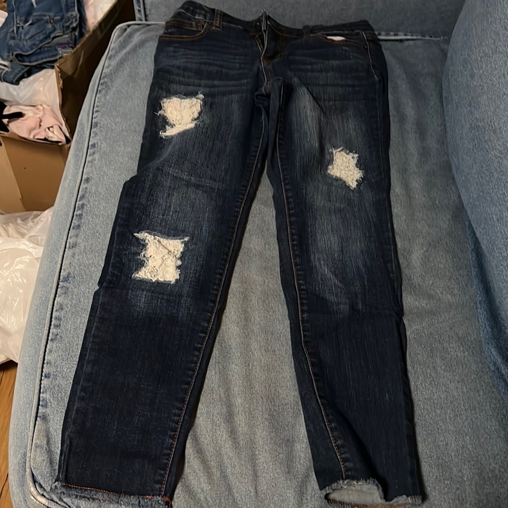 Jeans with holes and lace in the holes